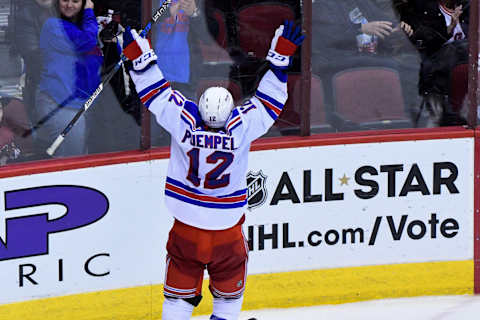 Dec 29, 2016; Glendale, AZ, USA; New York Rangers left wing Matt Puempel (12) celebrates after scoring his third goal of the game for a hat trick during the third period against the Arizona Coyotes at Gila River Arena. Mandatory Credit: Matt Kartozian-USA TODAY Sports