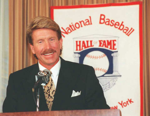 NEW YORK, UNITED STATES: Mike Schmidt, the former Philadelphia Phillies’ third baseman, appears at a press conference 10 January after being elected into the Hall of Fame by the Baseball Writers Association of America 09 January. Schmidt, the eighth third baseman inducted into the hall and the 26th player to be elected in his first year of eligibility, will be inducted in a ceremony in Cooperstown, New York on 30 July. (COLOR KEY: Banner has red lettering and border.) (Photo credit should read HENNY RAY ABRAMS/AFP via Getty Images)