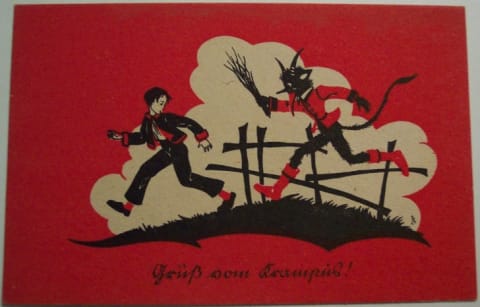 Postcard of Krampus chasing a child.