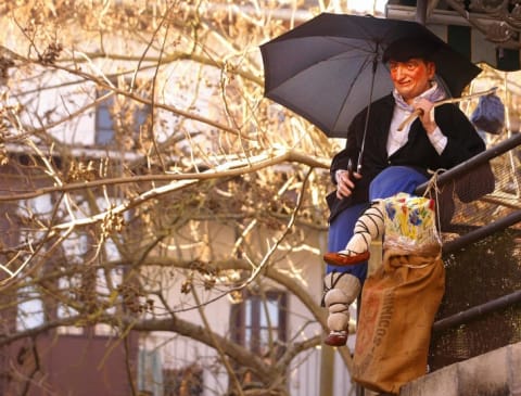 An Olentzero figure sitting on a balcony.