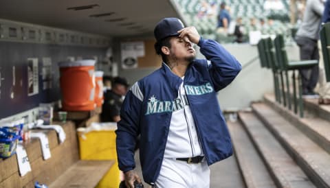 SEATTLE, WA – AUGUST 2: Starting pitcher Felix Hernandez #34 of the Seattle Mariners puts on his at as he walks through the dugout before a game against the Toronto Blue Jays mat Safeco Field on August 2, 2018 in Seattle, Washington. The Blue Jays won 7-3. (Photo by Stephen Brashear/Getty Images)