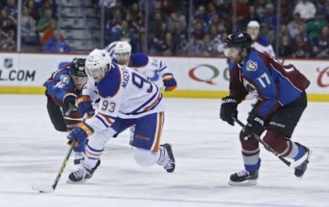 Mar 30, 2015; Denver, CO, USA; Edmonton Oilers center Ryan Nugent-Hopkins (93) skates past Colorado Avalanche left wing Gabriel Landeskog (92) during the third period at Pepsi Center. The Oilers won 4-1. Mandatory Credit: Chris Humphreys-USA TODAY Sports