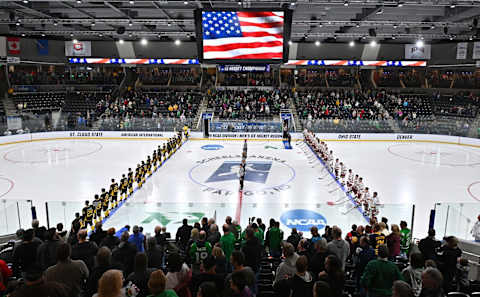 FARGO, NORTH DAKOTA – MARCH 30: The American International Yellow Jackets and the Denver Pioneers line up for the singing of the American national anthem before the NCAA Division I Men’s Ice Hockey West Regional Championship Final at Scheels Arena on March 30, 2019 in Fargo, North Dakota. (Photo by Sam Wasson/Getty Images)