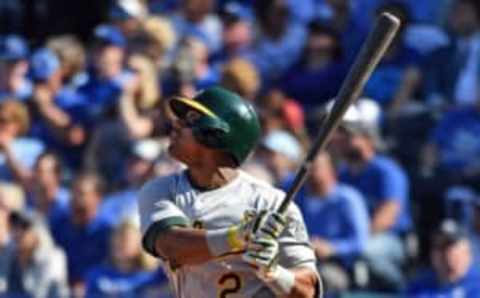 Apr 10, 2017; Kansas City, MO, USA; Oakland Athletics left fielder Khris Davis (2) hits a two run home run against the Kansas City Royals during the fourth inning at Kauffman Stadium. Mandatory Credit: Peter G. Aiken-USA TODAY Sports