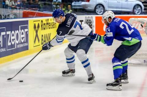 OSTRAVA, CZECH REPUBLIC – MAY 07: Esa Lindell (L) of Finland and Rok Ticar (R) of Slovenia battle for the puck during the IIHF World Championship group B match between Finland and Slovenia at CEZ Arena on May 7, 2015 in Ostrava, Czech Republic. (Photo by Matej Divizna/Getty Images)