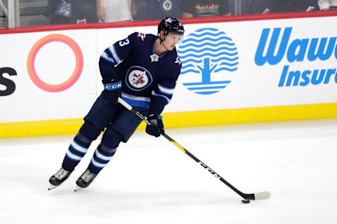 Sep 22, 2019; Winnipeg, Manitoba, CAN; Winnipeg Jets left wing Kristian Vesalainen (93) warms up before a game against the Calgary Flames at Bell MTS Place. Mandatory Credit: James Carey Lauder-USA TODAY Sports