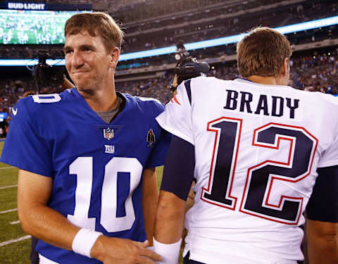 EAST RUTHERFORD, NJ – AUGUST 30: Eli Manning #10 of the New York Giants greets Tom Brady #12 of the New England Patriots after a pre-season NFL game at MetLife Stadium on August 30, 2018 in East Rutherford, New Jersey. (Photo by Jeff Zelevansky/Getty Images)