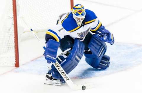 May 19, 2016; San Jose, CA, USA; St. Louis Blues goalie Brian Elliott (1) deflects a shot by the San Jose Sharks in the third period in game three of the Western Conference Final of the 2016 Stanley Cup Playoffs at SAP Center at San Jose. The Sharks won 3-0. Mandatory Credit: John Hefti-USA TODAY Sports