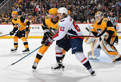 PITTSBURGH, PA – MARCH 12: Brian Dumoulin #8 of the Pittsburgh Penguins battles for position against Carl Hagelin #62 of the Washington Capitals at PPG Paints Arena on March 12, 2019 in Pittsburgh, Pennsylvania. (Photo by Joe Sargent/NHLI via Getty Images)