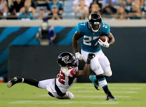 JACKSONVILLE, FL – AUGUST 25: Leonard Fournette #27 of the Jacksonville Jaguars runs past Emmanuel Ellerbee #52 of the Atlanta Falcons during a preseason game at TIAA Bank Field on August 25, 2018 in Jacksonville, Florida. (Photo by Sam Greenwood/Getty Images)