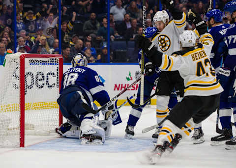 TAMPA, FL – DECEMBER 12: Goalie Andrei Vasilevskiy #88 of the Tampa Bay Lightning gives up a goal against John Moore #27 of the Boston Bruins during the third period at Amalie Arena on December 12, 2019 in Tampa, Florida. (Photo by Mark LoMoglio/NHLI via Getty Images)”n