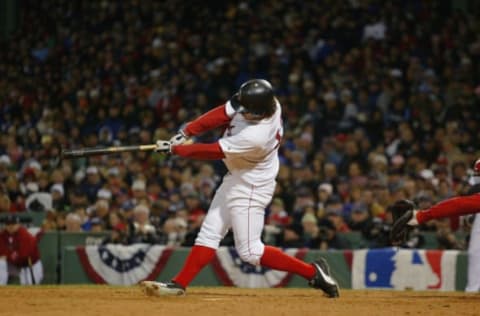 BOSTON – OCTOBER 23: Mark Bellhorn of the Boston Red Sox hits a two-run home run in the eighth inning during game one of the 2004 World Series against the St. Louis Cardinals at Fenway Park on October 23, 2004 in Boston, Massachusetts. The Red Sox defeated the Cardinals 11-9. (Photo by Ron Vesely/MLB Photos via Getty Images)