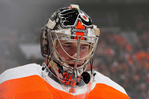 The Flyers’ Carter Hart looks on against the Detroit Red Wings. (Photo by Mitchell Leff/Getty Images)