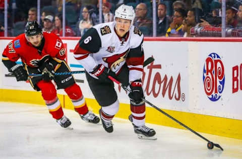 Oct 5, 2016; Calgary, Alberta, CAN; Arizona Coyotes defenseman Jakob Chychrun (6) controls the puck against Calgary Flames during the third period during a preseason hockey game at Scotiabank Saddledome. Calgary Flames won 2-1. Mandatory Credit: Sergei Belski-USA TODAY Sports