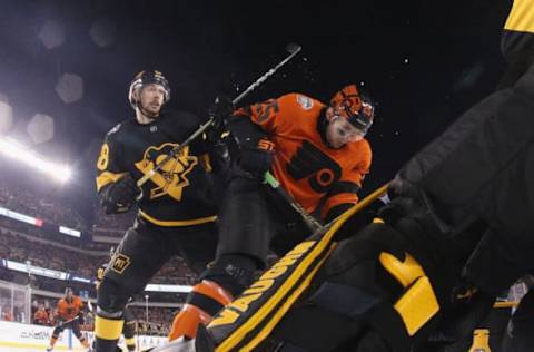 PHILADELPHIA, PENNSYLVANIA – FEBRUARY 23: Brian Dumoulin #8 of the Pittsburgh Penguins checks James van Riemsdyk #25 of the Philadelphia Flyers during the 2019 Coors Light NHL Stadium Series game at the Lincoln Financial Field on February 23, 2019 in Philadelphia, Pennsylvania. The Flyers defeated the Penguins 4-3 in overtime. (Photo by Bruce Bennett/Getty Images)