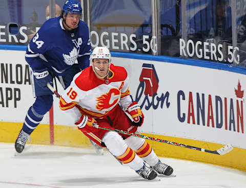 TORONTO, ON – FEBRUARY 22: Matthew Tkachuk #19 of the Calgary Flames skates against Auston Matthews #34 of the Toronto Maple Leafs  (Photo by Claus Andersen/Getty Images)