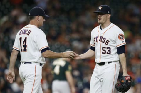 HOUSTON, TX – JULY 10: Manager AJ Hinch #14 of the Houston Astros takes the ball from KenGiles #53 in the ninth inning against the Oakland Athletics at Minute Maid Park on July 10, 2018 in Houston, Texas. (Photo by Bob Levey/Getty Images)