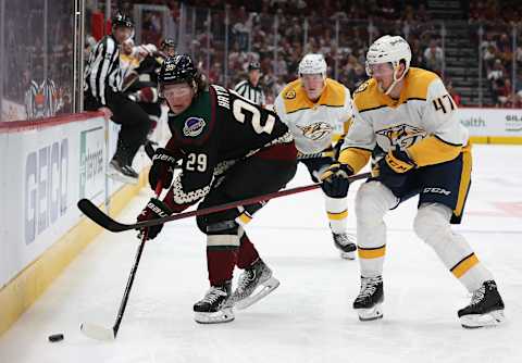 GLENDALE, ARIZONA – APRIL 29: Barrett Hayton #29 of the Arizona Coyotes controls the puck ahead of Michael McCarron #47 of the Nashville Predators during the second period of the NHL game at Gila River Arena on April 29, 2022 in Glendale, Arizona. (Photo by Christian Petersen/Getty Images)