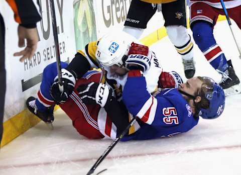 NEW YORK, NEW YORK – MAY 11: Evgeni Malkin #71 of the Pittsburgh Penguins and Ryan Lindgren #55 of the New York Rangers tangle during the third period in Game Five of the First Round of the 2022 Stanley Cup Playoffs at Madison Square Garden on May 11, 2022 in New York City. The Rangers defeated the Penguins 5-3. (Photo by Bruce Bennett/Getty Images)