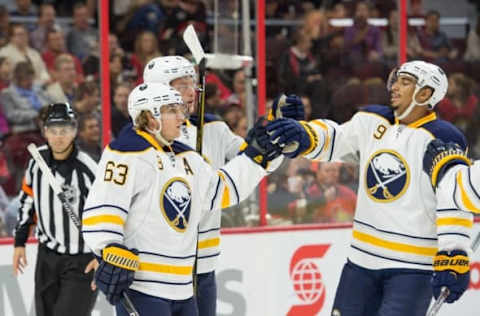 Sep 26, 2015; Ottawa, Ontario, CAN; The Buffalo Sabres celebrate a goal scored by center Tyler Ennis (63) in the first period against the Ottawa Senators at Canadian Tire Centre. Mandatory Credit: Marc DesRosiers-USA TODAY Sports