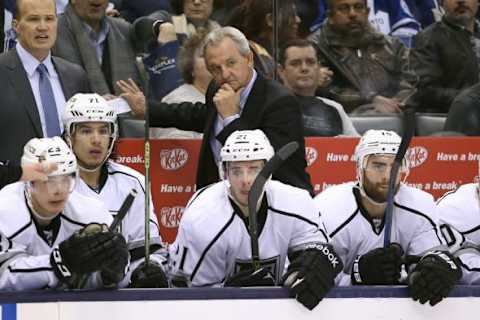 Dec 19, 2015; Toronto, Ontario, CAN; Los Angeles Kings head coach Darryl Sutter looks on from behind the bench against the Toronto Maple Leafs at Air Canada Centre. The Maple Leafs beat the Kings 5-0. Mandatory Credit: Tom Szczerbowski-USA TODAY Sports