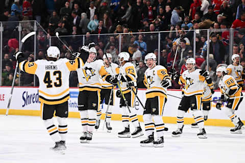 MONTREAL, CANADA – DECEMBER 13: Jansen Harkins #43 of the Pittsburgh Penguins celebrates as he joins his teammates after scoring the game-winning goal in a shootout against the Montreal Canadiens at the Bell Centre on December 13, 2023 in Montreal, Quebec, Canada. The Pittsburgh Penguins defeated the Montreal Canadiens 4-3 in a shootout. (Photo by Minas Panagiotakis/Getty Images)