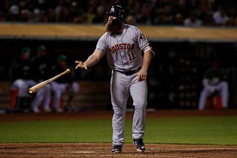 OAKLAND, CA – AUGUST 17: Evan Gattis #11 of the Houston Astros tosses his bat after drawing a walk against the Oakland Athletics during the sixth inning at the Oakland Coliseum on August 17, 2018 in Oakland, California. The Oakland Athletics defeated the Houston Astros 4-3 in 10 innings. (Photo by Jason O. Watson/Getty Images)