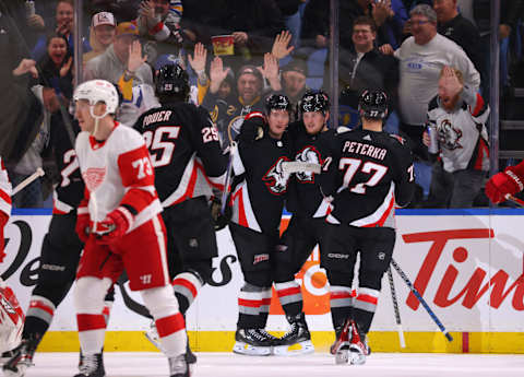 Dec 29, 2022; Buffalo, New York, USA; Buffalo Sabres center Casey Mittelstadt (37) celebrates his goal with teammates during the first period against the Detroit Red Wings at KeyBank Center. Mandatory Credit: Timothy T. Ludwig-USA TODAY Sports