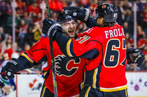 Dec 23, 2016; Calgary, Alberta, CAN; Calgary Flames defenseman Mark Giordano (5) celebrates his goal with right wing Michael Frolik (67) against the Vancouver Canucks during the second period at Scotiabank Saddledome. Mandatory Credit: Sergei Belski-USA TODAY Sports