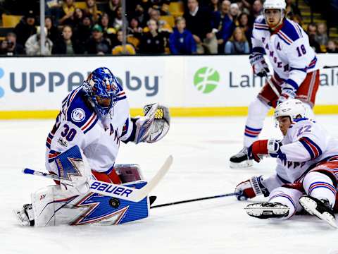 Mar 2, 2017; Boston, MA, USA; New York Rangers goalie Henrik Lundqvist (30) makes a save in front of defenseman Nick Holden (22) during the first period against the Boston Bruins at TD Garden. Mandatory Credit: Bob DeChiara-USA TODAY Sports