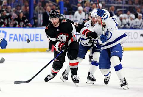 Mar 4, 2023; Buffalo, New York, USA; Buffalo Sabres defenseman Mattias Samuelsson (23) and Tampa Bay Lightning left wing Brandon Hagel (38) go after a loose puck during the second period at KeyBank Center. Mandatory Credit: Timothy T. Ludwig-USA TODAY Sports