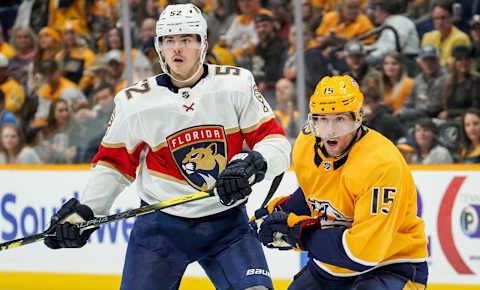 NASHVILLE, TN – OCTOBER 19: Craig Smith #15 of the Nashville Predators skates against MacKenzie Weegar #52 of the Florida Panthers at Bridgestone Arena on October 19, 2019 in Nashville, Tennessee. (Photo by John Russell/NHLI via Getty Images)