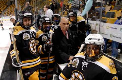 BOSTON – JANUARY 19: Willie O’Ree formerly of the Boston Bruins sits on the bench with members of the S.C.O.R.E. Boston Diversity Program at TD Banknorth Garden January 19, 2008 in Boston, Massachusetts. O’Ree was celebrating his 50th anniversary as being the first black player to play in the NHL. (Photo by Steve Babineau/NHLI via Getty Images)