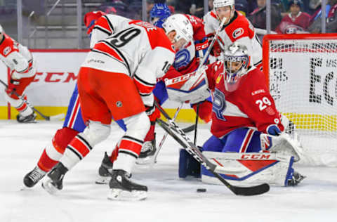 LAVAL, QC, CANADA – DECEMBER 29: Etienne Marcoux #29 of the Laval Rocket about to make a pad save against Morgan Geekie #19 of the Charlotte Checkers at Place Bell on December 29, 2018 in Laval, Quebec. (Photo by Stephane Dube /Getty Images)