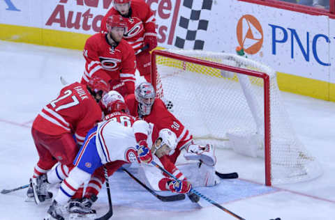 RALEIGH, NC – NOVEMBER 18: Max Pacioretty #67 of the Montreal Canadiens works to score against Justin Faulk #27, Teuvo Teravainen #86, and Cam Ward #30 of the Carolina Hurricanes during the game at PNC Arena on November 18, 2016, in Raleigh, North Carolina. The Hurricanes won 3-2. (Photo by Grant Halverson/Getty Images)