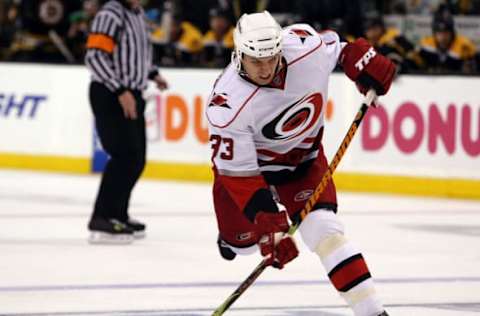 BOSTON – MAY 03: Anton Babchuk #33 of the Carolina Hurricanes takes a shot in the second period against the Boston Bruins during Game Two of the Eastern Conference Semifinal Round of the 2009 Stanley Cup Playoffs on May 3, 2009 at the TD Banknorth Garden in Boston, Massachusetts. (Photo by Elsa/Getty Images)