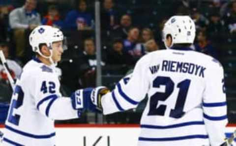 Dec 27, 2015; Brooklyn, NY, USA; Toronto Maple Leafs center Tyler Bozak (42) is congratulated by left wing James van Riemsdyk (21) after scoring a second period goal against the New York Islanders at Barclays Center. Mandatory Credit: Andy Marlin-USA TODAY Sports