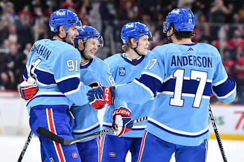 MONTREAL, CANADA – NOVEMBER 15: Evgenii Dadonov #63 of the Montreal Canadiens celebrates his goal with teammates Sean Monahan #91, Kaiden Guhle #21 and Josh Anderson #17 during the second period of the game against the New Jersey Devils at Centre Bell on November 15, 2022 in Montreal, Quebec, Canada. (Photo by Minas Panagiotakis/Getty Images)