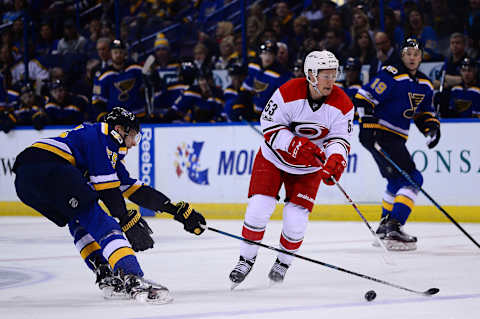 Jan 5, 2017; St. Louis, MO, USA; Carolina Hurricanes left wing Jeff Skinner (53) and St. Louis Blues defenseman Colton Parayko (55) battle for the puck during the first period at Scottrade Center. The Hurricanes won 4-2. Mandatory Credit: Jeff Curry-USA TODAY Sports