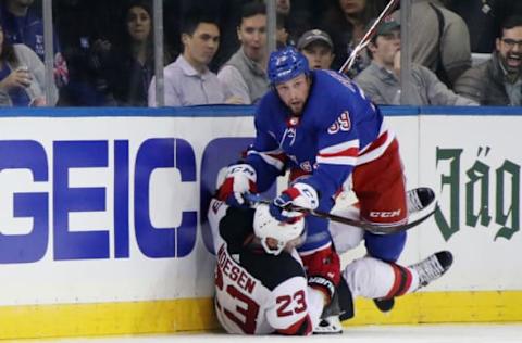 NEW YORK, NEW YORK – SEPTEMBER 24: Matt Beleskey #39 of the New York Rangers checks Stefan Noesen #23 of the New Jersey Devils during the first period at Madison Square Garden on September 24, 2018 in New York City. (Photo by Bruce Bennett/Getty Images)