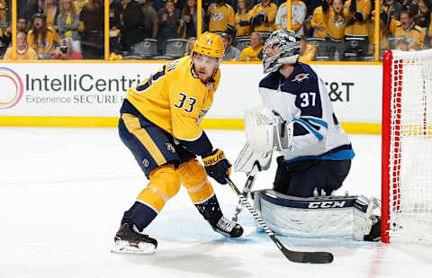 NASHVILLE, TN – MAY 10: Viktor Arvidsson #33 of the Nashville Predators skates against Connor Hellebuyck #37 of the Winnipeg Jets in Game Seven of the Western Conference Second Round during the 2018 NHL Stanley Cup Playoffs at Bridgestone Arena on May 10, 2018 in Nashville, Tennessee. (Photo by John Russell/NHLI via Getty Images) *** Local Caption *** Viktor Arvidsson;Connor Hellebuyck