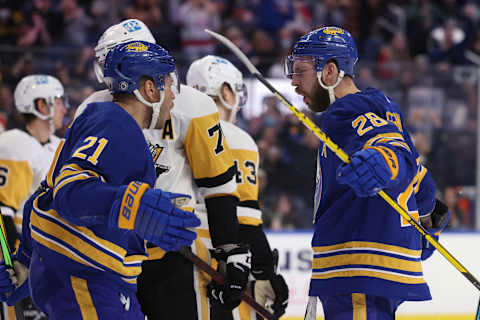 Mar 23, 2022; Buffalo, New York, USA; Buffalo Sabres left wing Zemgus Girgensons (28) celebrates his goal with right wing Kyle Okposo (21) during the second period against the Pittsburgh Penguins at KeyBank Center. Mandatory Credit: Timothy T. Ludwig-USA TODAY Sports