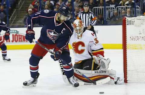 Nov 23, 2016; Columbus, OH, USA; Columbus Blue Jackets left wing Nick Foligno (71) takes a shot against Calgary Flames goalie Chad Johnson (31) during the second period at Nationwide Arena. Mandatory Credit: Russell LaBounty-USA TODAY Sports