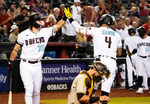 Sep 15, 2022; Phoenix, Arizona, USA; Arizona Diamondbacks Ketel Marte (4) high-fives Jake McCarthy (30) after hitting a home run against the San Diego Padres in the fourth inning at Chase Field.Mlb Dodgers At D Backs