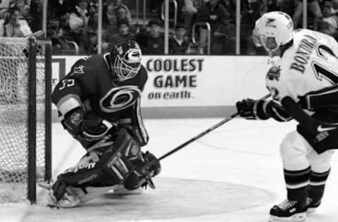 04/19/98 – MCI Center – Caps’ Peter Bondra shoots the puck high into the net as he scores a short-handed goal past Carolina goalie Pat Jablonski during 2nd period action. Bondra’s goal was his 2nd of the game and the 52nd of the season as the Caps went onto to win 2-1. – Photo By Rich Lipski TWP (Photo by Rich Lipski/The Washington Post/Getty Images)