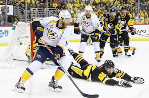 PITTSBURGH, PA - MAY 29: Mattias Ekholm #14 of the Nashville Predators controls the puck against Brian Dumoulin #8 of the Pittsburgh Penguins during the second period in Game One of the 2017 NHL Stanley Cup Final at PPG Paints Arena on May 29, 2017 in Pittsburgh, Pennsylvania. (Photo by Bruce Bennett/Getty Images)