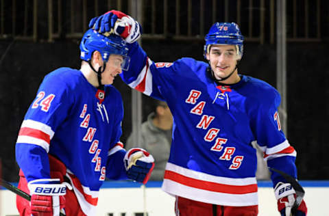 NEW YORK, NEW YORK – NOVEMBER 12: Brady Skjei #76 pats Kaapo Kakko #24 of the New York Rangers on the head after Kakko scored the game-winning goal in overtime for a score of 3-2 over the Pittsburgh Penguins at Madison Square Garden on November 12, 2019, in New York City. (Photo by Emilee Chinn/Getty Images)