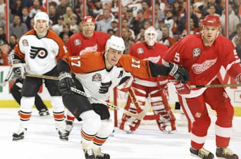 3 Jun 1997: Center Rod Brind’Amour #17 of the Philadelphia Flyers (center) holds back Nicklas Lidstrom #5 of the Detroit Red Wings during Game 2 of the Stanley Cup Finals at the CoreStates Center in Philadelphia, Pennsylvania. The Red Wings won the game, 4-2.