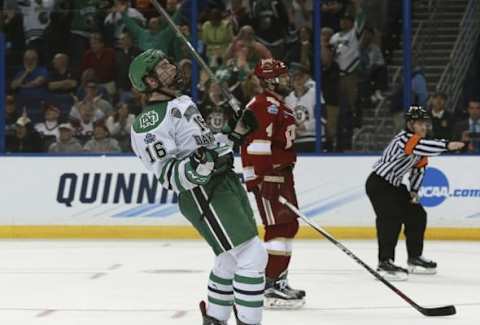 Apr 7, 2016; Tampa, FL, USA; North Dakota Fighting Hawks forward Brock Boeser (16) celebrates after they score an empty net goal against the Denver Pioneers during the third period at the semifinals of the 2016 Frozen Four college ice hockey tournament at Amalie Arena. North Dakota Fighting Hawks defeated the Denver Pioneers 4-2. Mandatory Credit: Kim Klement-USA TODAY Sports