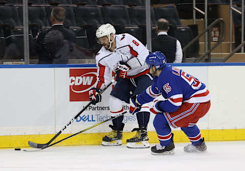 NEW YORK, NEW YORK – MARCH 30: Alex Ovechkin #8 of the Washington Capitals skates against Ryan Lindgren #55 of the New York Rangers during their game at Madison Square Garden on March 30, 2021 in New York City. (Photo by Al Bello/Getty Images)